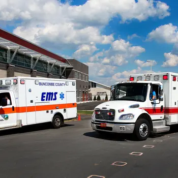 Two EMS vehicles in a parking lot