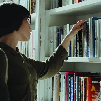 Student picking out textbooks.