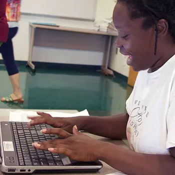 Student Typing on a laptop