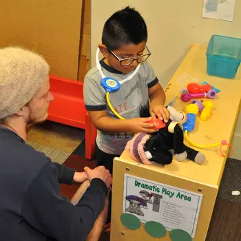 Education student working with a small child