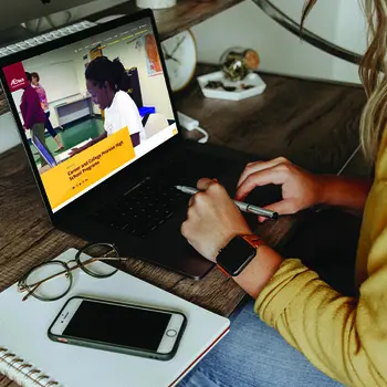 Someone typing on a laptop