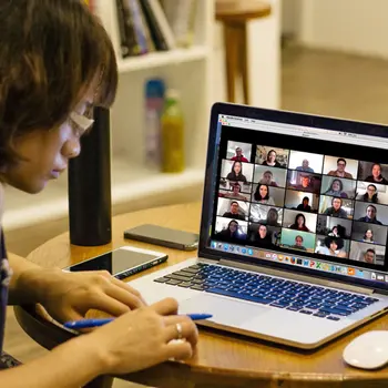 Student using a laptop on a Zoom session