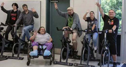 SOAR Students in class on exercise equipment