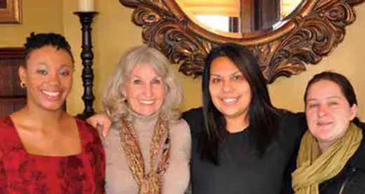 Four smiling women
