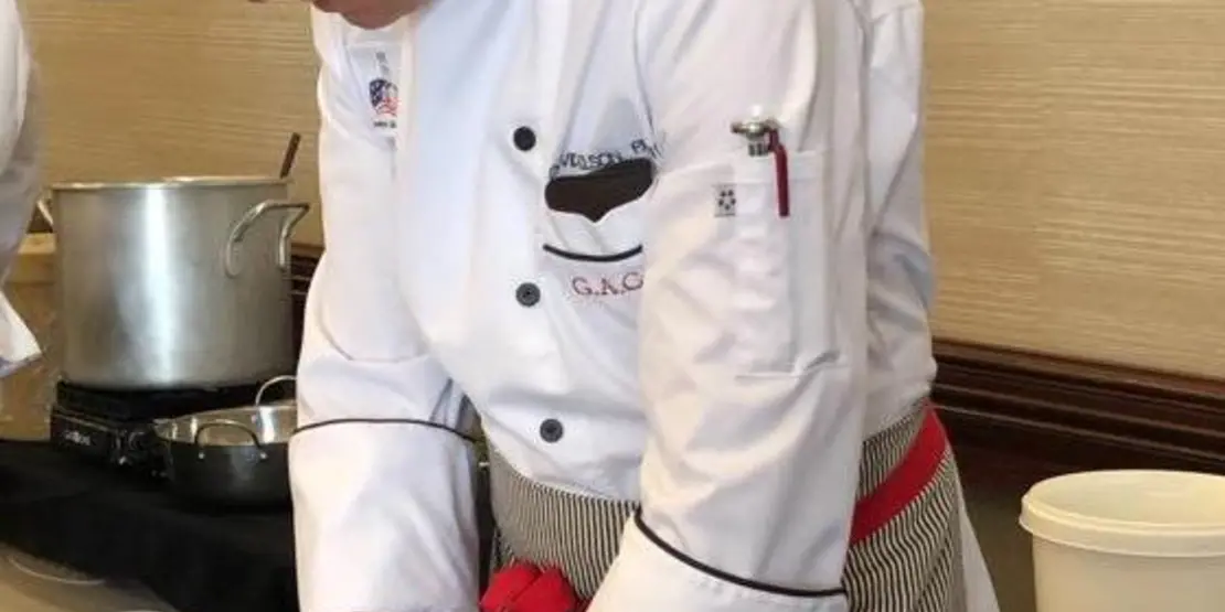 Culinary student chopping food