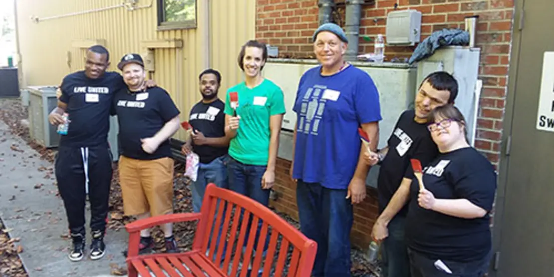 People standing around a bench at United Ways Days of Impact event