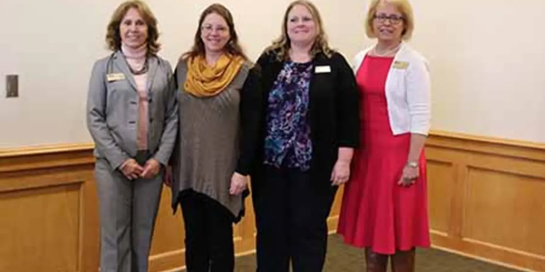 Faculty Handbook group of 4 people