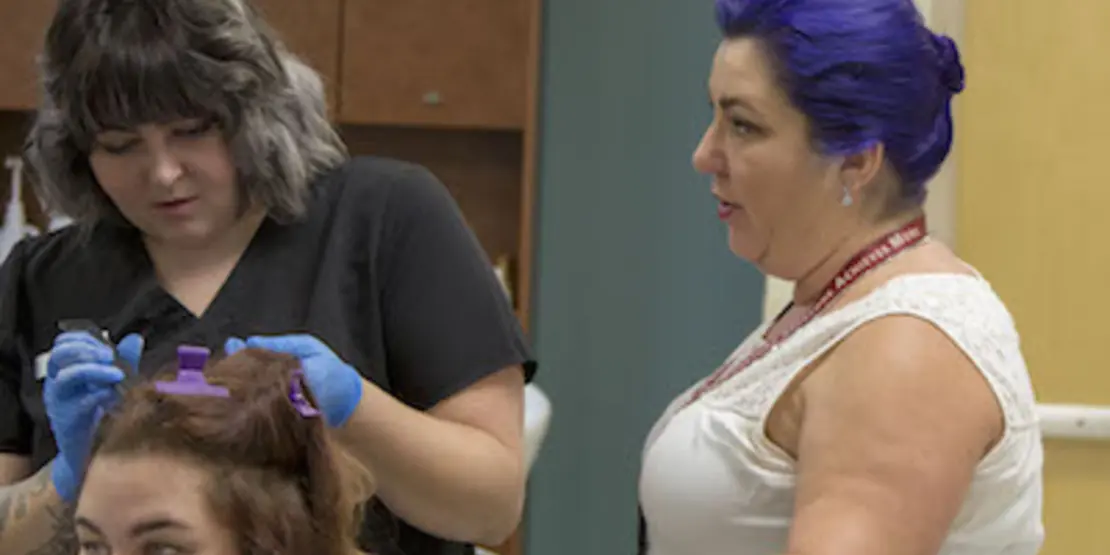 Amanda Palacios teaching two students