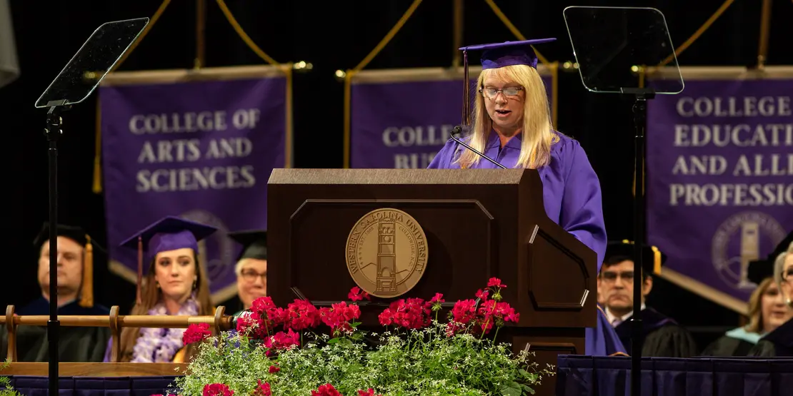 Mary Lewis at lectern