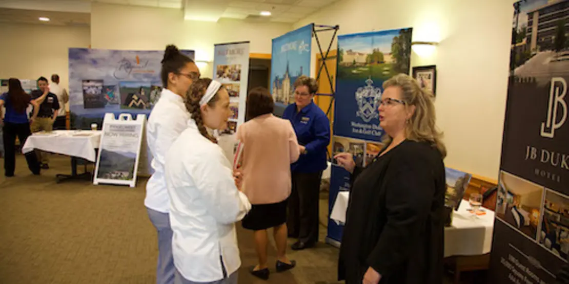 People standing in front of displays