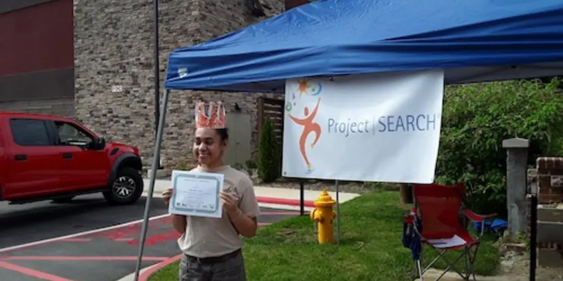 Cherise Lynn with a certificate