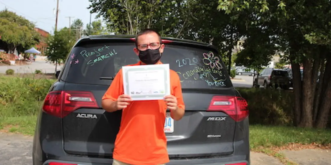 Nicholas Hermachandra with a certificate