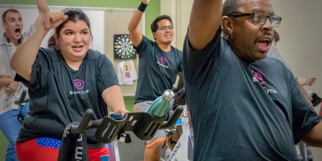 People on exercise bikes