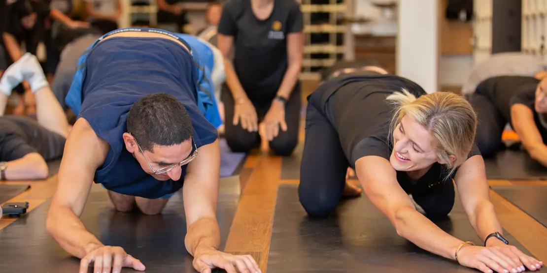 People stretching on yoga mats