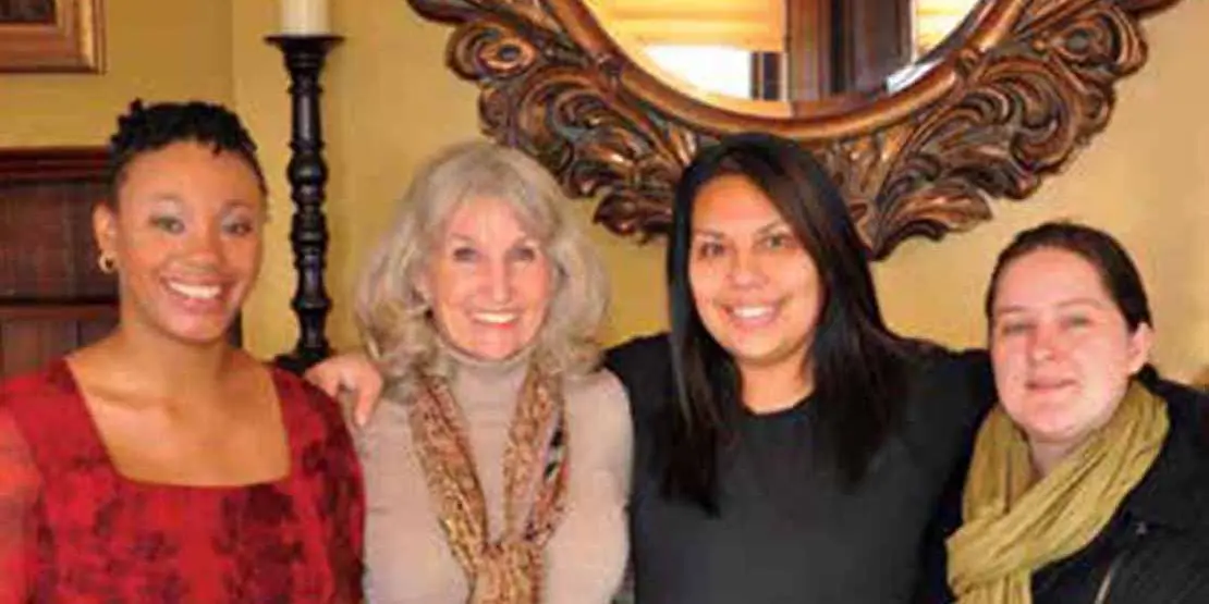 Four smiling women