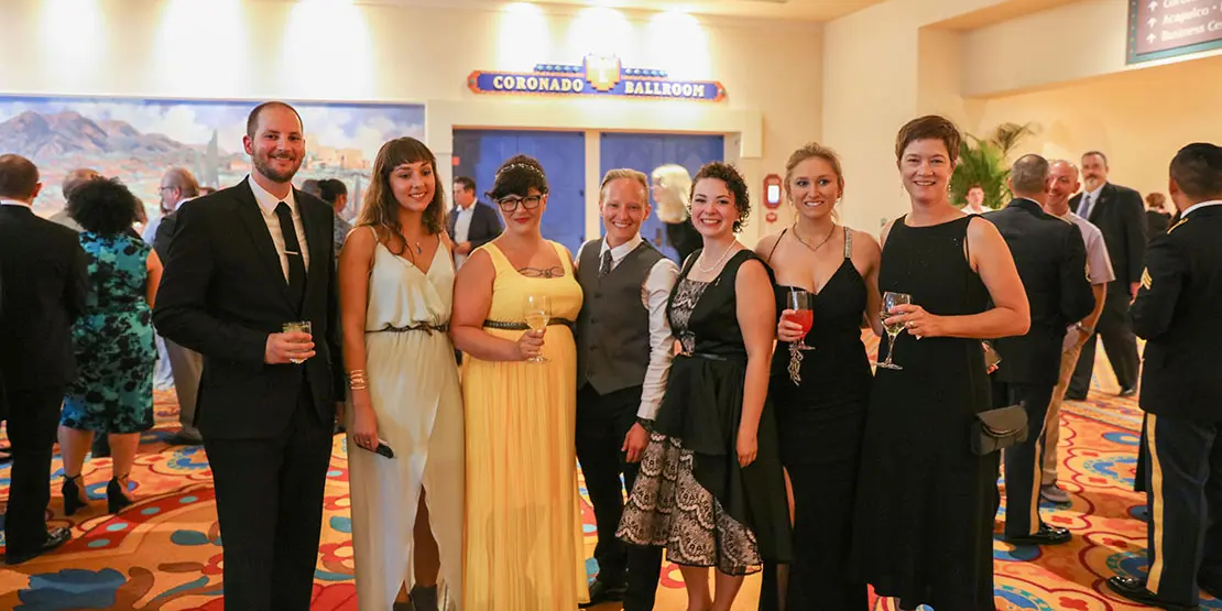 Five chefs with formal wear with coaches.