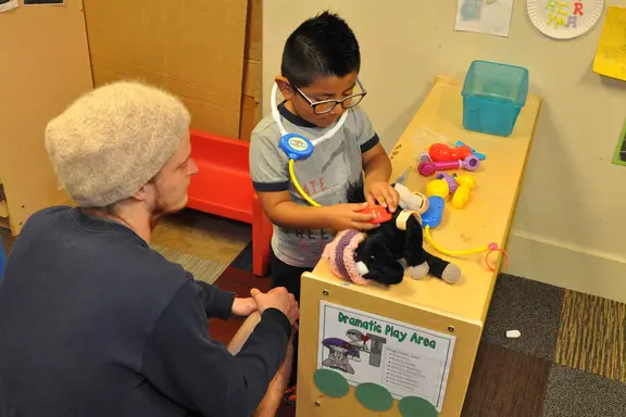 Education student working with a small child