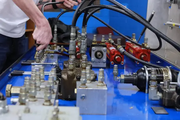 Industrial Systems Technology students working on machinery