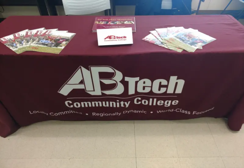Hiring and onboarding table at job fair