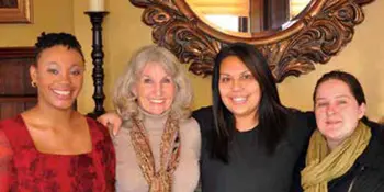 Four smiling women