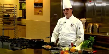 Chef standing behind a counter