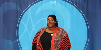 Marshay Proctor-Bates in front of blue background