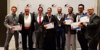Eight people in formal wear standing in front of a wall with ACF logos